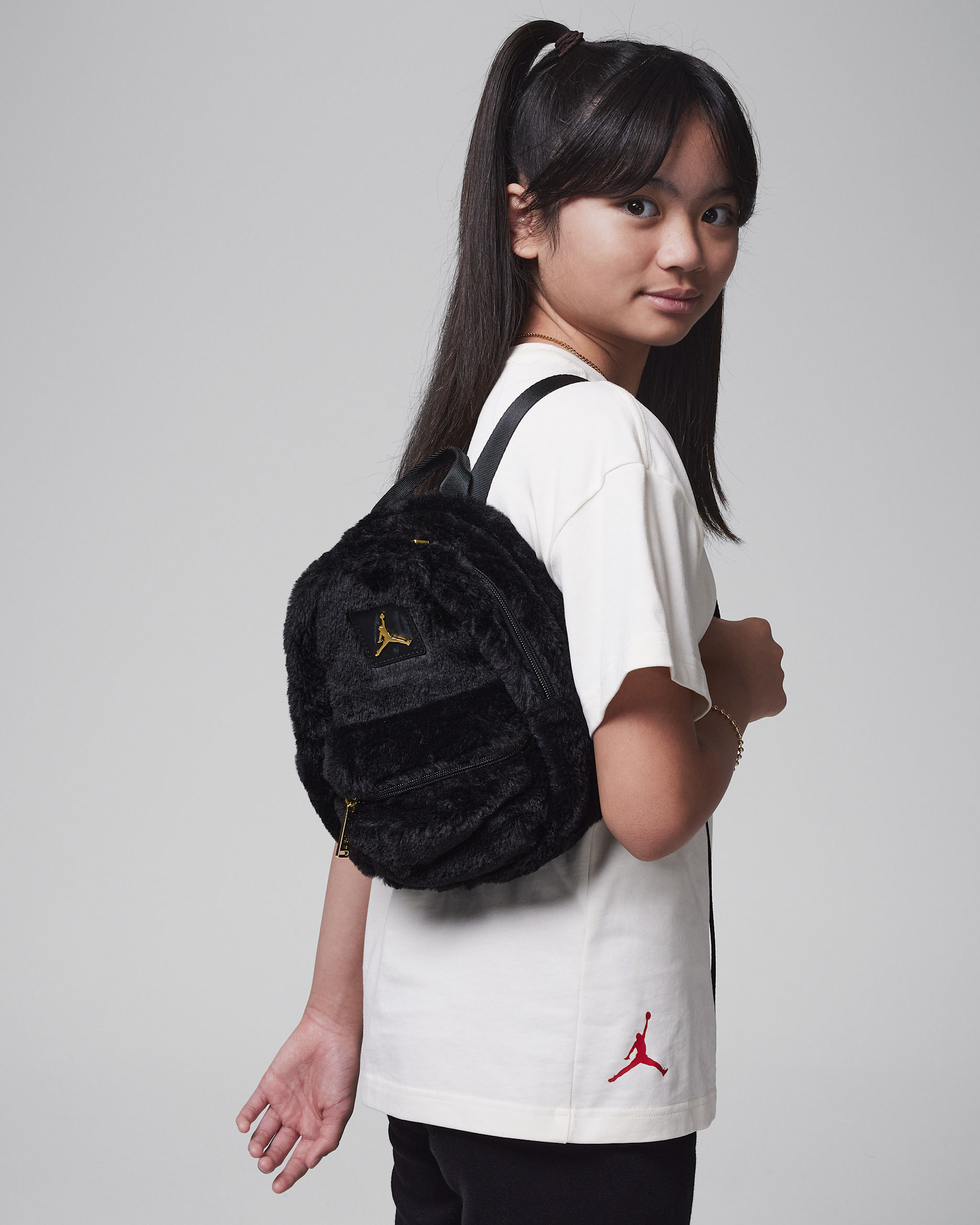 Jordan Big Kids' Faux Fur Mini Backpack (4L). Nike JP